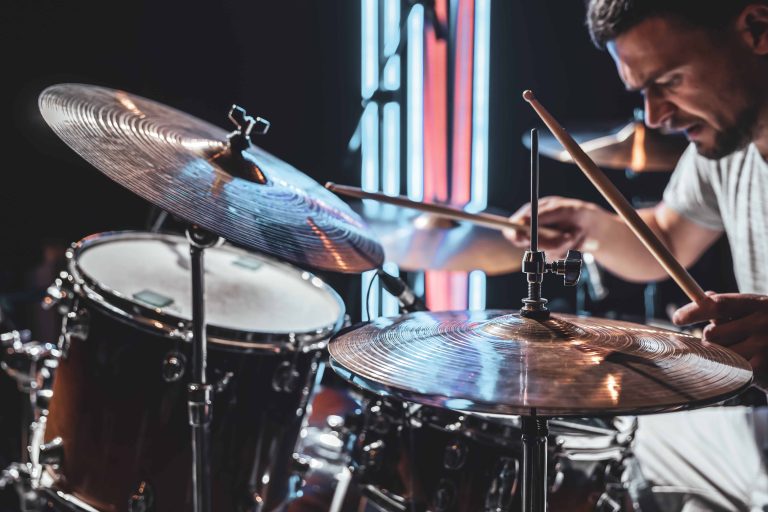 close-up-drum-cymbals-as-drummer-plays-with-beautiful-lighting-blurred-background