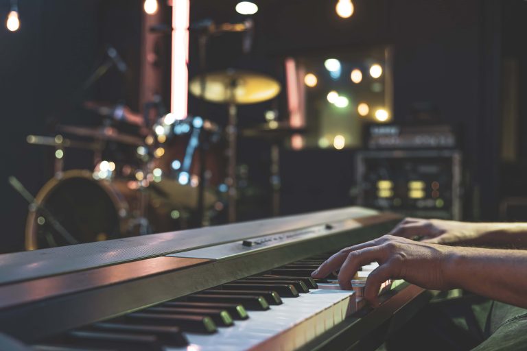 Hands of a musician playing the keys close up